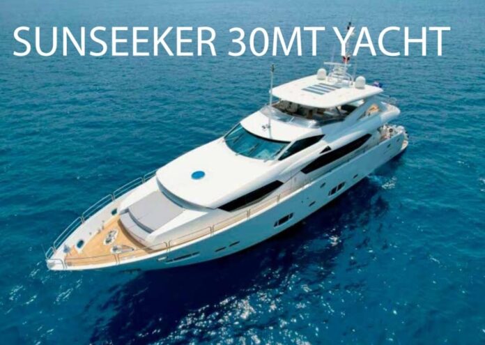 Motor Yacht Torba — motor yachts and traditional boats moored beside a wooden jetty in Torba Bay, Bodrum.