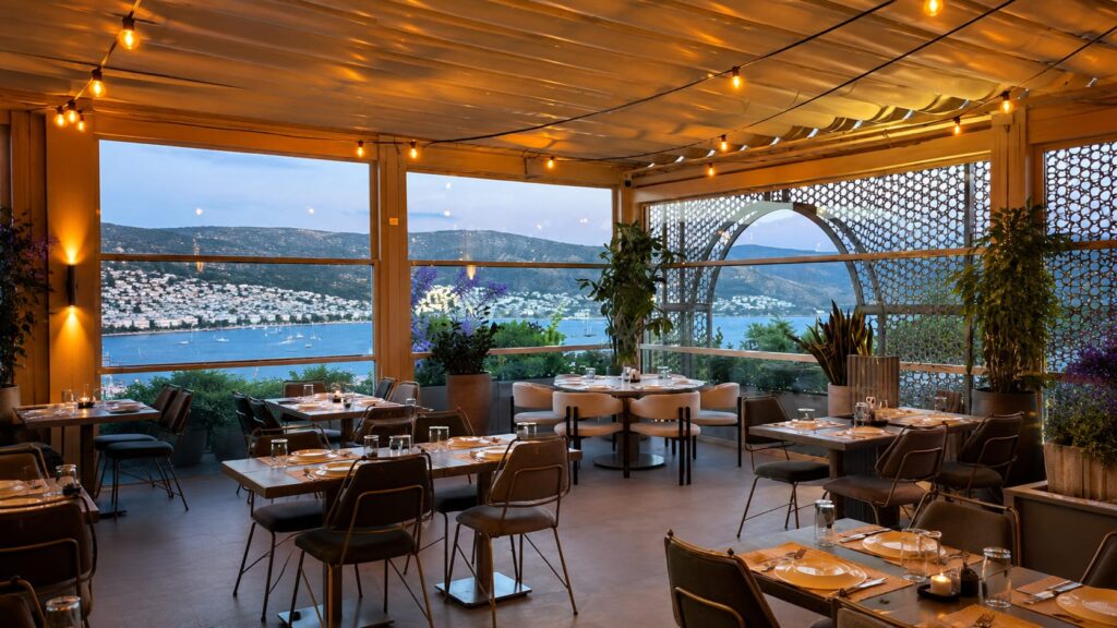 Afitap Meyhane Bodrum elegant Turkish meyhane restaurant interior with stylish seafood mezes, rakı tables, live music atmosphere and luxury dining experience in Bodrum Marina area