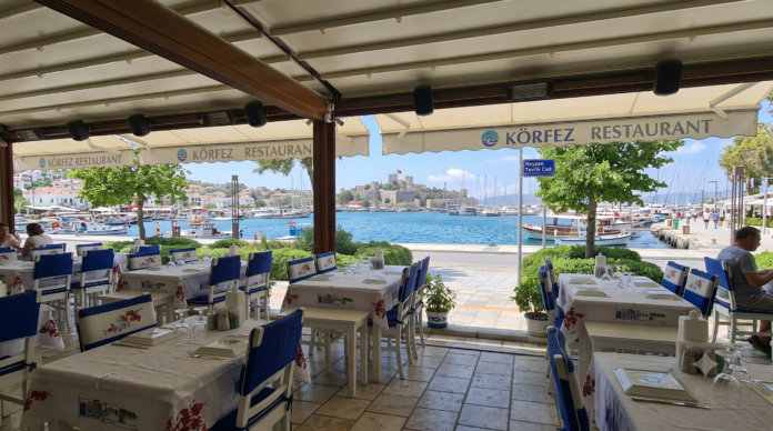 Körfez Restaurant Bodrum located at Bodrum Marina serving fresh seafood, traditional Aegean mezes, Çökertme Kebabı, grilled octopus, and luxury dining with sea view in the heart of Bodrum.