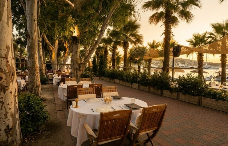 Okaliptus Hotel Beach Club Restaurant in Bitez Bodrum featuring luxury beachfront dining, private cabanas, stylish sunbeds, Mediterranean cuisine, crystal-clear sea view, premium beach club atmosphere, relaxing seaside restaurant experience in Bodrum Turkey Okaliptus Hotel Beach Club Restaurant