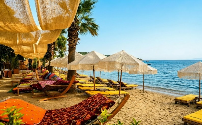 Okaliptus Hotel Beach Club Bitez luxury beachfront cabanas private umbrellas sunset restaurant crystal clear sea watersports VIP beach experience in the heart of Bitez Bay Bodrum Okaliptus Hotel Beach Club