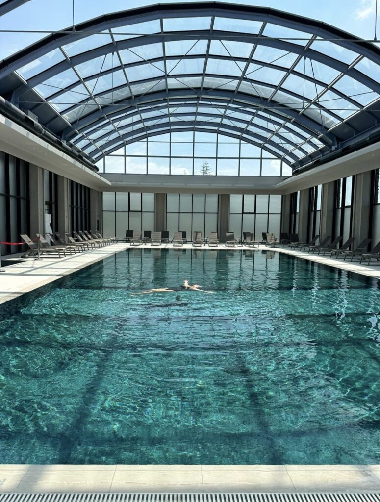 A luxury thermal escape at Sinnada Resort & Thermaland in Afyon, featuring elegant accommodation, botanical thermal pools, tropical greenery, and premium spa facilities.